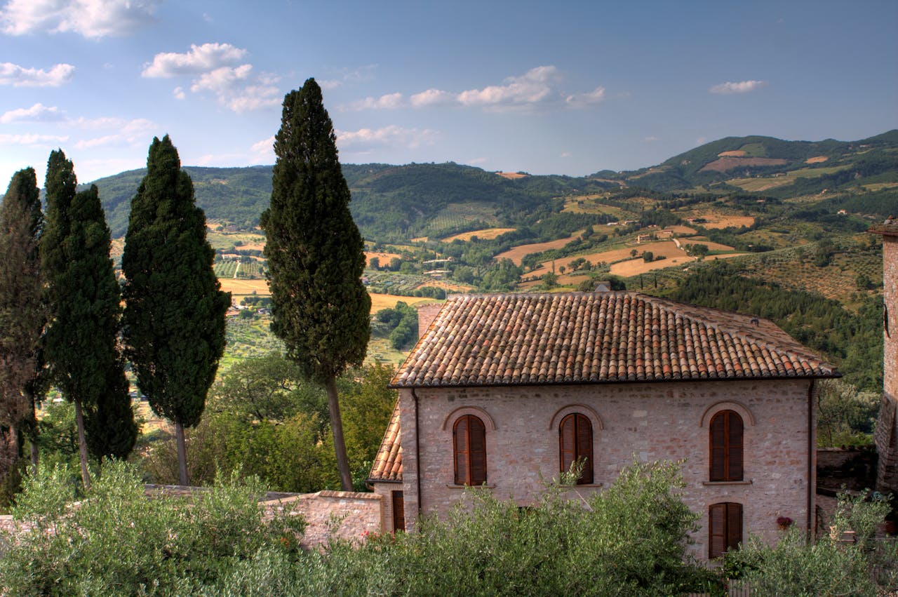 Captivating view of Assisi's rolling hills and traditional architecture in Umbria, Italy.